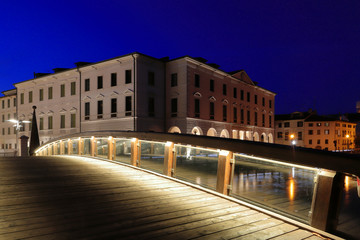 Fototapeta premium historical buildings and bridge on the river in treviso city in italy