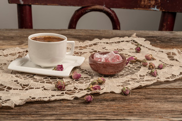 coffee and turkish delight on table decorated with dried rose flowers