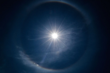 Halo in the blue sky around the sun