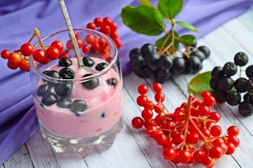 Ripe,fresh berries.Delicious dessert in a glass Cup on the table.