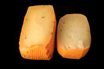 top view closeup two halves of assorted hard cheese heads
