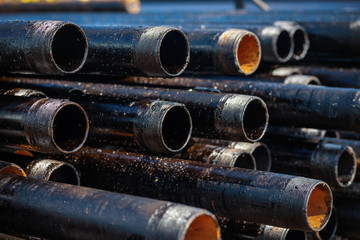 Close up drill pipe thread with pipe dope grease lay down on rig floor at oil and gas on shore location.