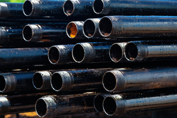 Close up drill pipe thread with pipe dope grease lay down on rig floor at oil and gas on shore...