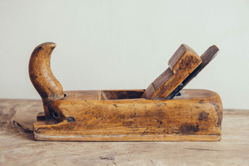 Old construction tools on a wooden workbench flat lay background with copy space. Old woodworking hand tool