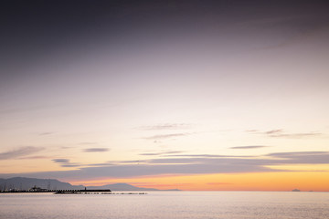 sun coming up over the sea