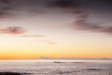 sun coming up over the sea