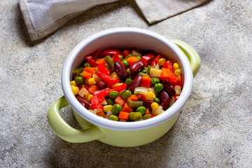 Boiled mix of vegetables in green pot