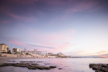 beach landscape with a cityscape behind