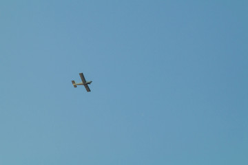 small plane flying low in the sky
