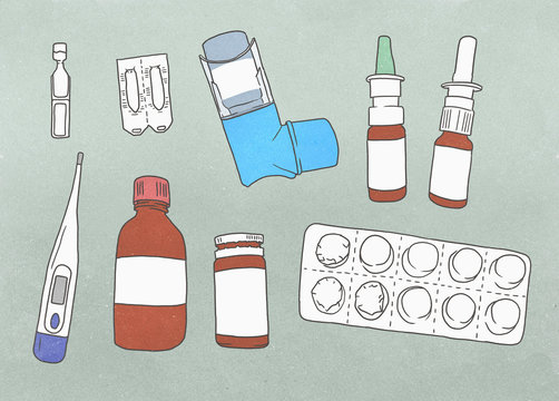 Medical supplies arranged against a gray background