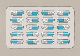 Blister pack of capsules against gray background