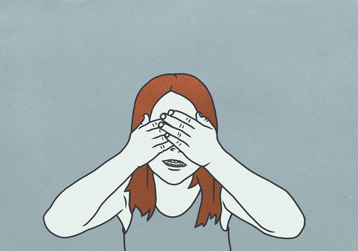 A girl with brown hair covering her eyes