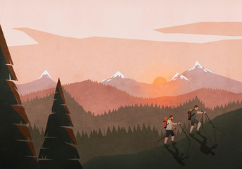 Men hiking along idyllic, tranquil sunset mountain and forest landscape