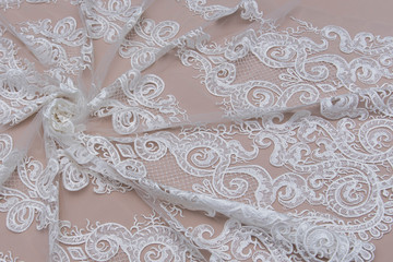 Texture lace fabric. lace on white background studio. thin fabric made of yarn or thread. a...