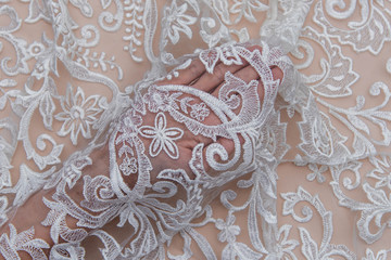 Texture lace fabric. lace on white background studio. thin fabric made of yarn or thread. a...