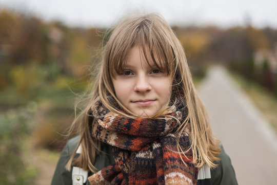Portrait confident tween girl in scarf