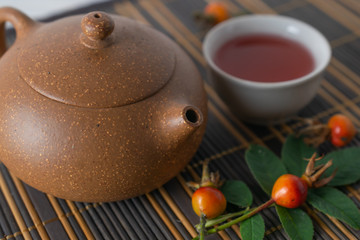 Asian traditional tea pot with healthy natural herbal tea