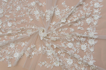 Texture lace fabric. lace on white background studio. thin fabric made of yarn or thread. a...