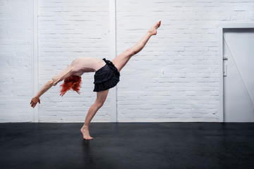 Graceful modern female dancer performing