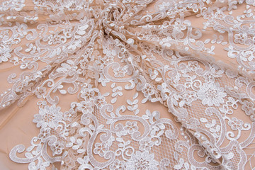 Texture lace fabric. lace on white background studio. thin fabric made of yarn or thread. a...