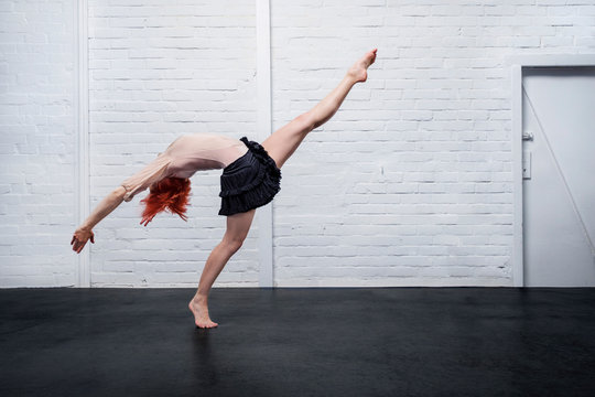 Graceful modern female dancer performing