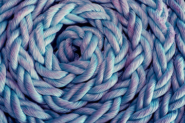 Texture of rope close up background, twisted rope of blue and violet color