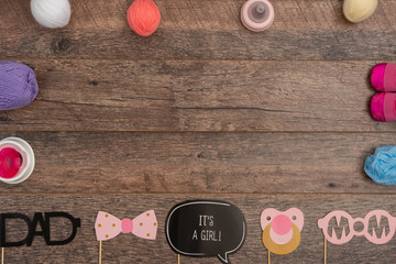 Close up of baby baptism props and yarn balls