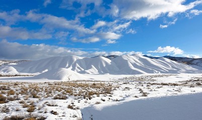 Snow covering The Painted Hills of Oregon in the winter, John Day Fossil Beds National Monument,...