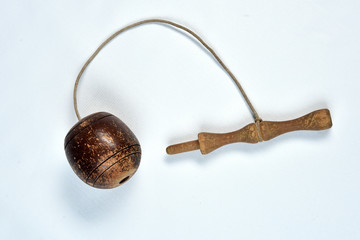 bilboquê, toy, old, brazilian, wooden ball tied by a rope on white background