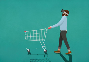 Man with virtual reality simulator pushing shopping cart