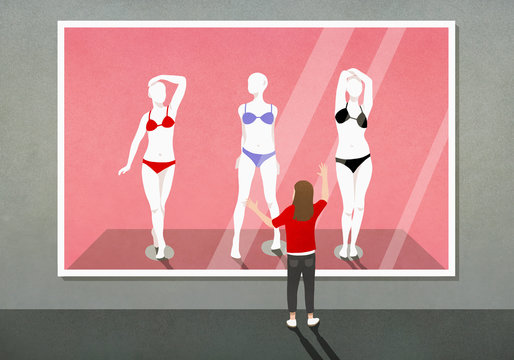 Girl looking at bikinis on mannequins photograph in art gallery