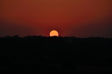 Obraz premium Perfect Cyprus sunset in the beautiful dark orange-red sky