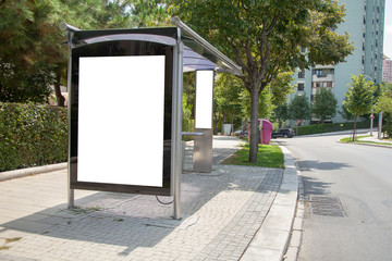 advertising board on asphalt roadadvertising board at bus stop on asphalt road