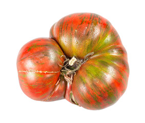 fresh large tomato with green veins isolated