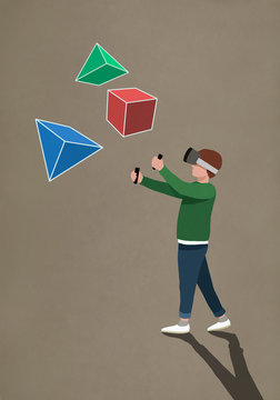 Boy with virtual reality simulator glasses looking at 3D geometric shapes