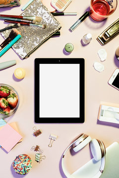 View form above digital tablet surrounded by personal belongings