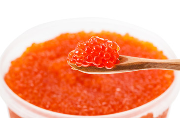 little wooden spoon with red caviar over container