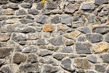 Old stone wall. Granite Wall Surface