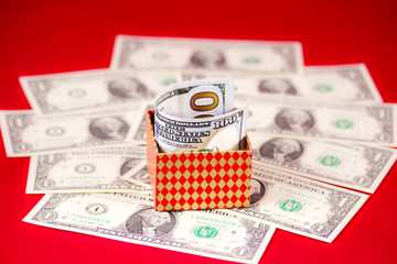 dollars and box on red background
