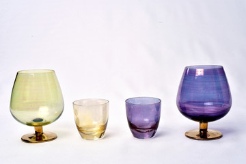 Colorful drinks glass cup on table on white background