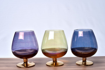 Colorful drinks glass cup on table on white background