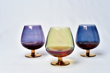 Colorful drinks glass cup on table on white background