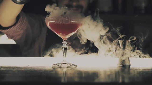 Halloween cocktail with dry ice at the bar