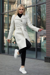 Young woman in a coat for autumn winter fashion