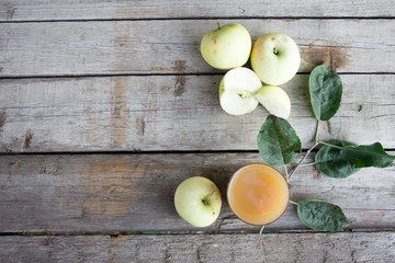 Apple juice in a handful of apples, top view. Copy space