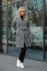 Young woman in a coat for autumn winter fashion