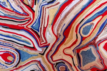 Foto op Plexiglas Close-up of multi-colored layers of fabric forming beautiful patterns © Konov