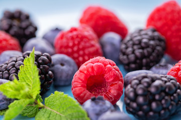 wild berries on a blue plate