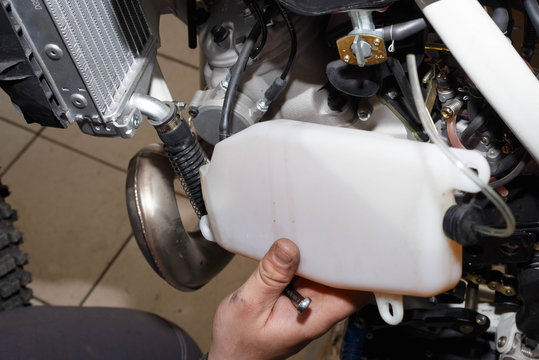 Removal, installation of a tank of the oil cooling system on a motorcycle.