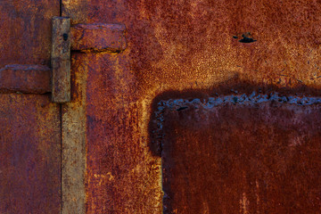 old rusty peeling fragment of a metal fence